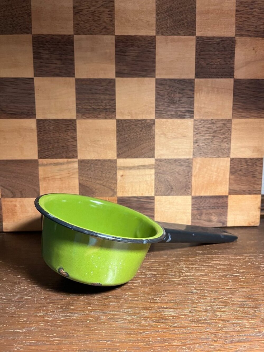 Vintage Small Avocado Green Enamel Pan with Black Handle, shows wear